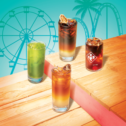 Boardwalk Refreshers menu with drinks on a wooden surface.